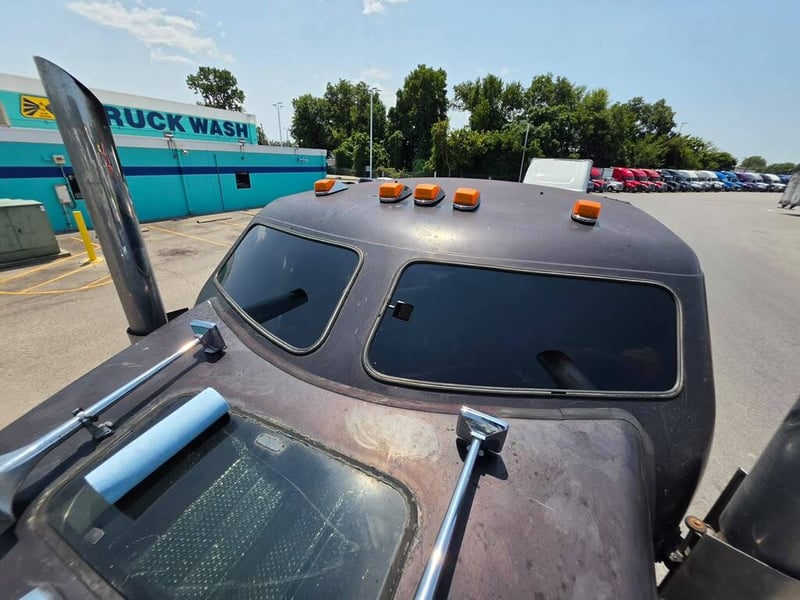 The same heavy truck cab with a new windshield set in place